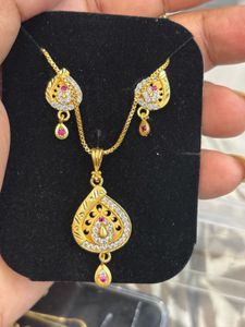 Elegant Gold Pendant & Earring Set