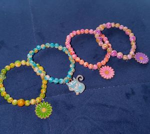 4 Beaded Bracelets with Charms