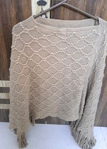 Beautiful Knit Poncho With Pattern Detailing. Beig