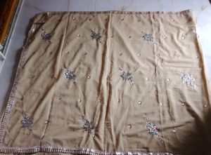 Elegant Beige Embellished Saree