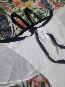 Chic White Cold Shoulder Top with Black Trim