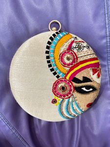 Cream Colour Round Handbag With Beautiful Handwork, Can Be Used As Slingbag Also.