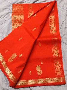 Vibrant Orange Saree with Gold Border