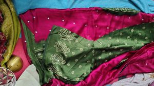 megenta Bandhani Saree with mehndi Border
