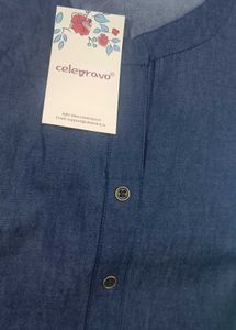 Denim shirt with floral tag