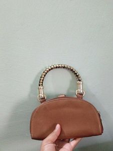 Stylish Brown Clutch with Unique Handle