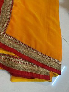 Vibrant Orange Saree with Brocade Blouse