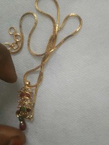 golden chain with ruby pendent