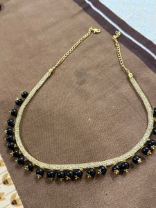 Elegant Gold Necklace with Black Beads