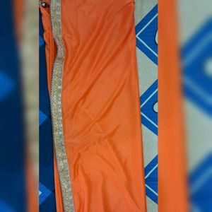 Sparkling Orange Saree with Golden Border ✨