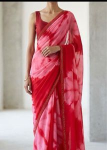 Stunning red tie-dye saree with unique embellishme