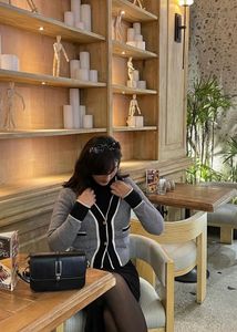 Chic grey cardigan with contrast trim 🤍
