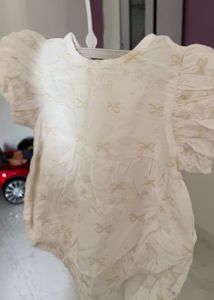 cream infant romper from anko features embroidered