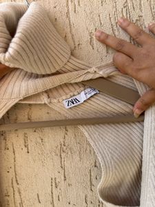 Cream Ribbed Turtleneck Sweater Arms
