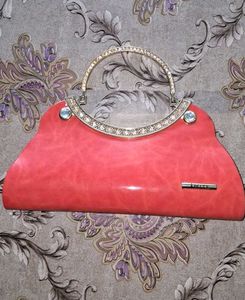 Elegant Coral Clutch Bag with Crystal Handle
