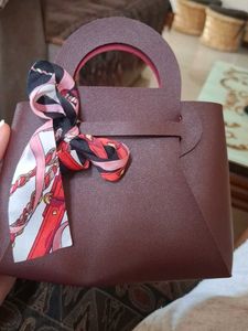 Chic Maroon Handbag with Scarf Accent