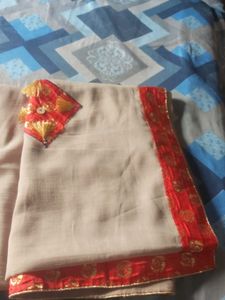 Elegant Beige Saree with Red Border