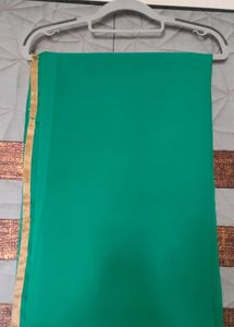 Elegant Green Saree with Gold Border
