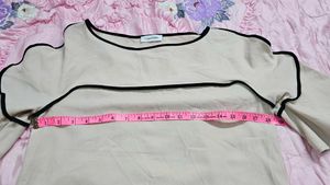 Calvin Klein Women's soft pink hue or light cream.
