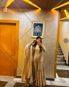 Elegant Tiered Gown with Cape