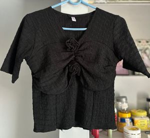 Chic Textured Black Top with Rose Detail