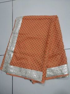 Elegant Orange Saree with Embellished Border