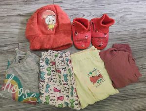 Bundle of baby clothes, beanie, shoes.