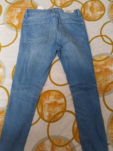Distressed Blue Denim Jeans