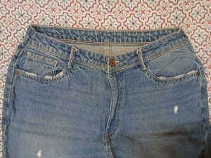 Distressed Blue Denim Jeans