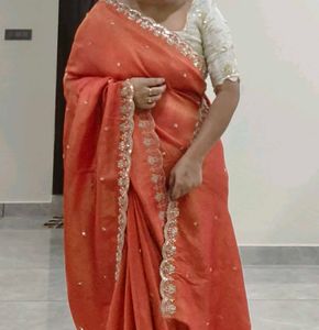 Orange Pure Tissue Embroidered saree