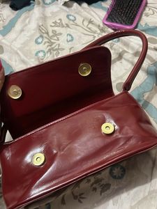 Chic Burgundy Patent Bow Clutch