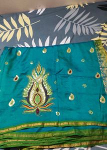 Elegant Teal Saree with Embellished Detailing