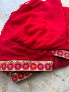 Elegant Red Saree with Embroidered Border