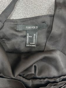 black ruched off-shoulder top or bandeau-style cro