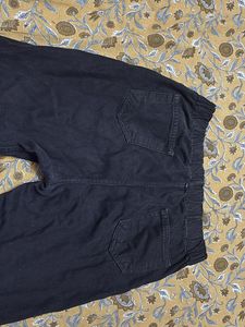 Edgy black flared jeans with side slits&amp;frayed hem