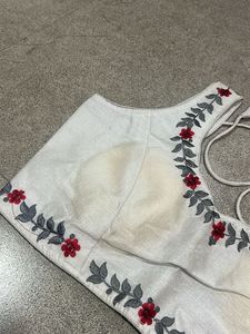 Embroidered White Sleeveless Blouse