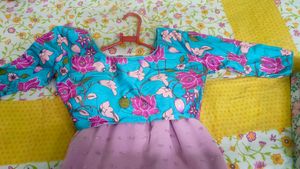 Elegant Pink Saree with Floral Blouse