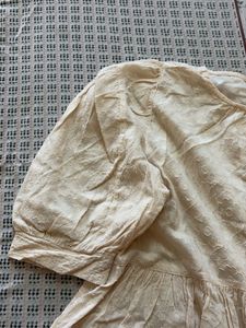 Cream Textured Peplum Top