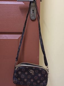 Spacious 3 compartment sling bag