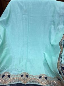 Elegant Teal Saree with Intricate Border