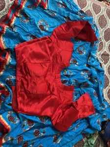 Vibrant Red Ethnic blouse and sky color chaniya