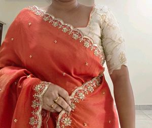 Orange Pure Tissue Embroidered saree