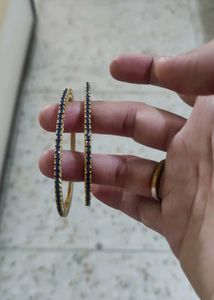 Elegant Gold Bangles with Blue Stones