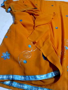 Orange Saree with Blue Embellishments
