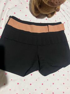 Chic Black Shorts with Peach Belt Detail