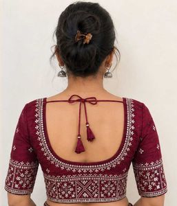 Maroon Blouse With White Embroidery.