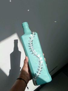 Decorative Teal Bottle with Vine Accent