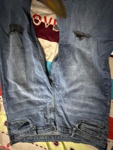 Distressed Blue Denim Jeans