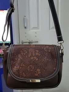 woman side sling bag