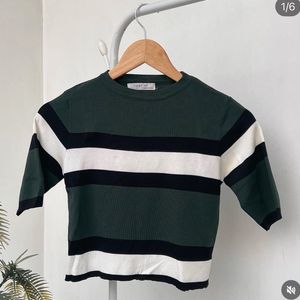 Green and White printed top.